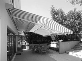 Folding arm awnings as protection against sunshine and rain, pic in b/w
