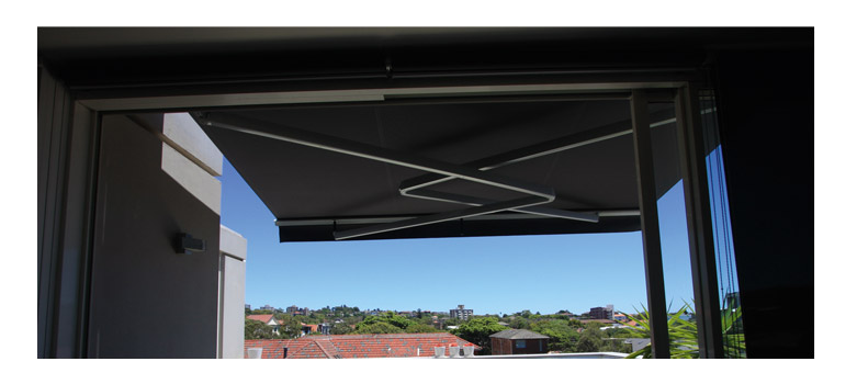 narrow awning with valance, intersecting folding arms